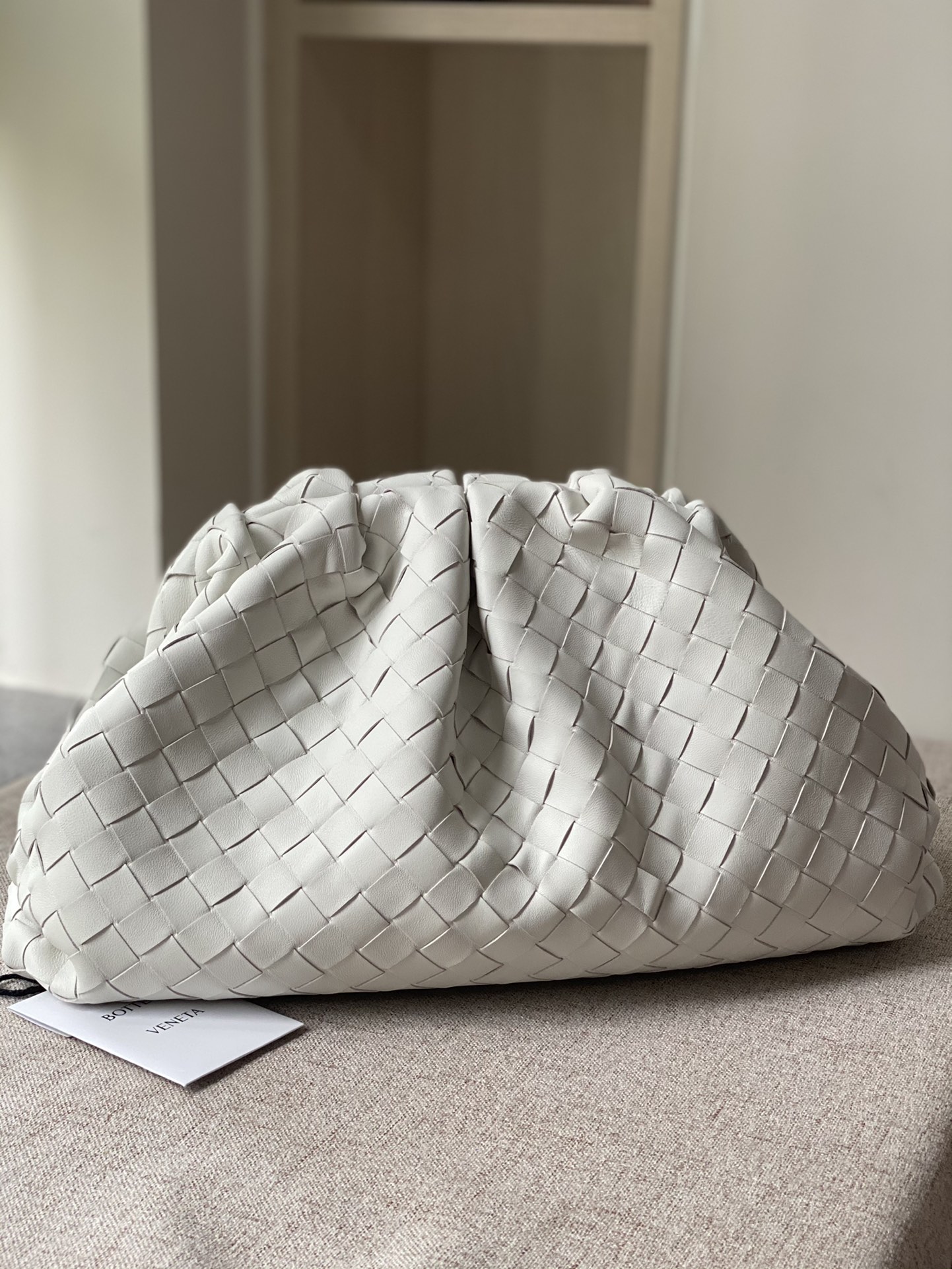 Bottega Veneta Pouch Soft Voluminous Clutch in Woven Lambskin Cream